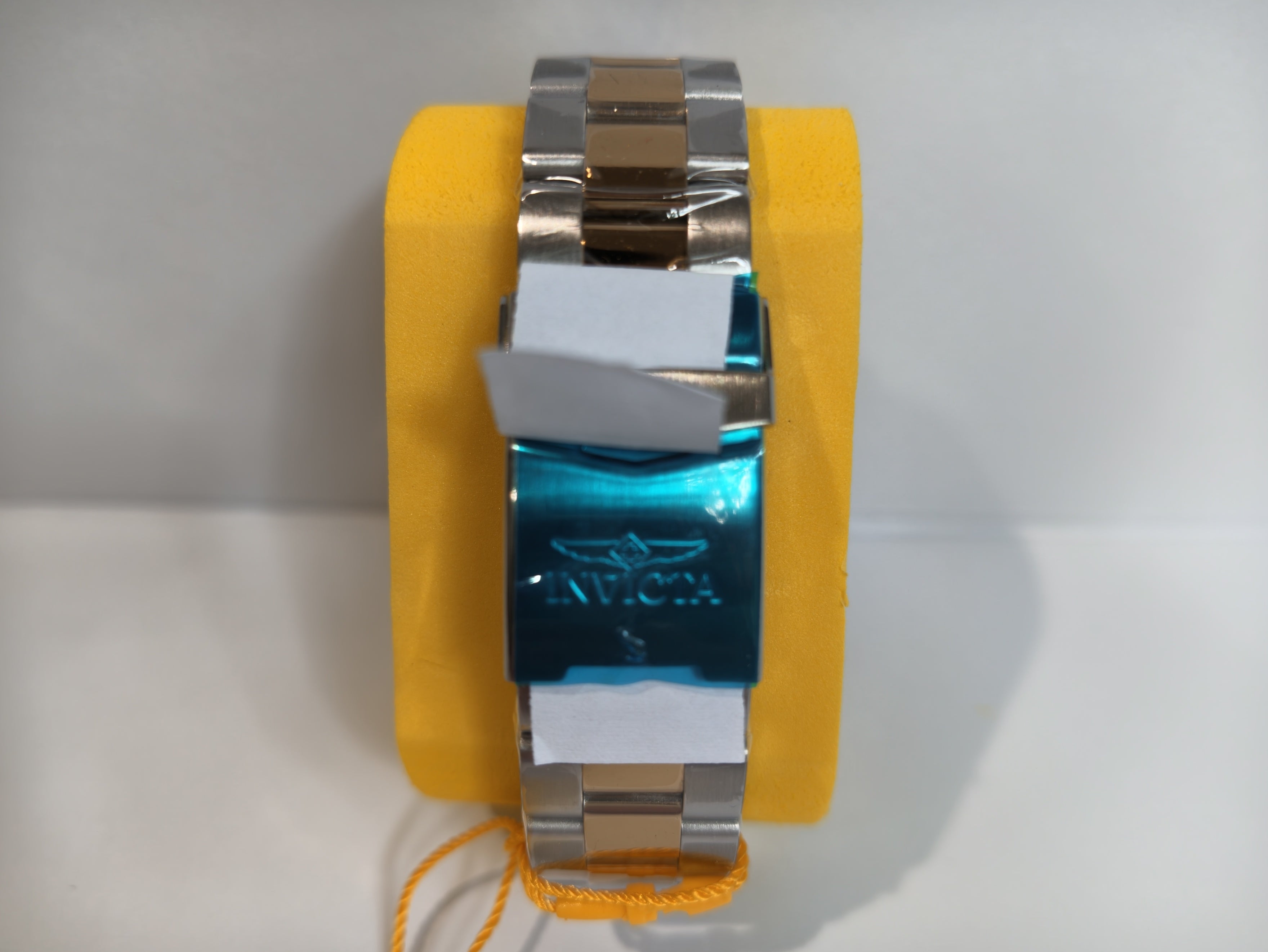 Invicta two-tone stainless steel watch bracelet and clasp detail

