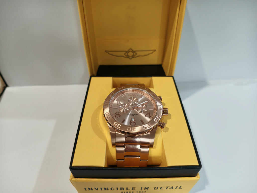 Invicta rose gold chronograph watch standing upright on display cushion