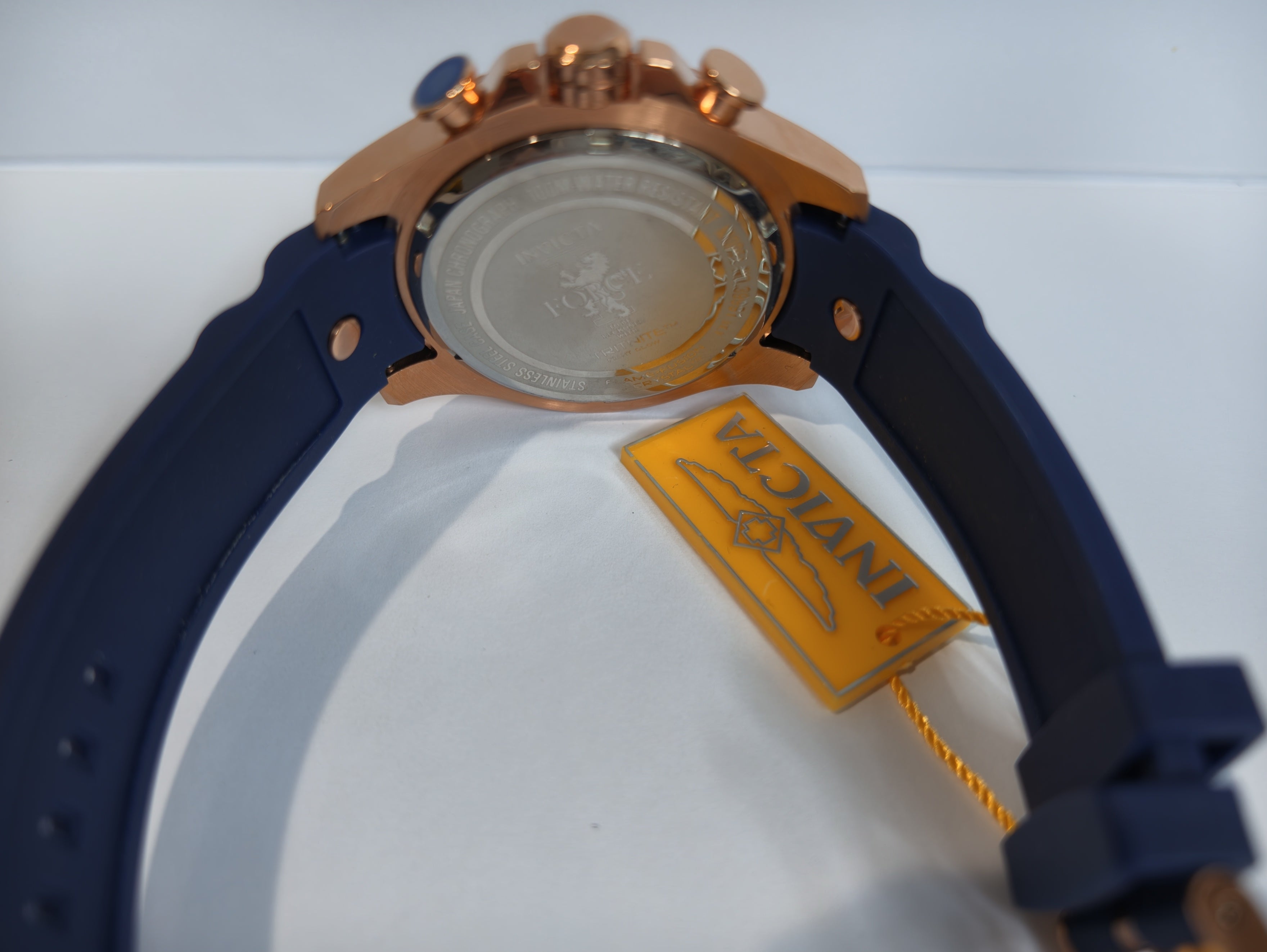 I-Force Axis watch side angle view on yellow display cushion with tag