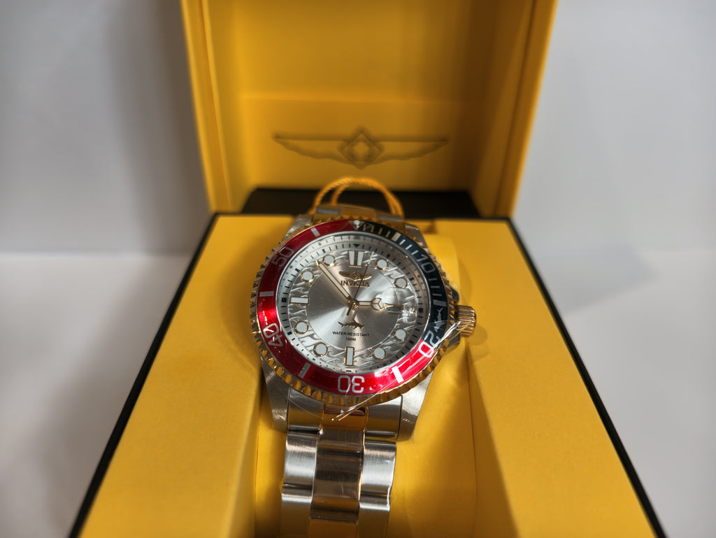 Invicta Pro Diver watch face close-up inside yellow gift box