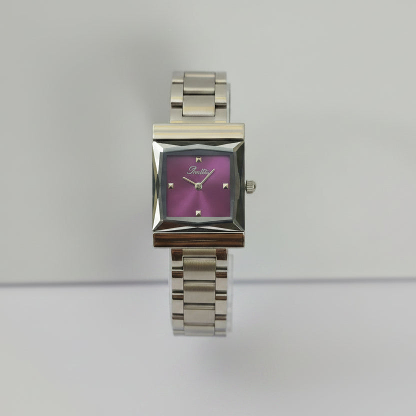 A women's stainless steel watch with a square bezel and a pink-purple dial, displayed on a clear stand against a light gray background.