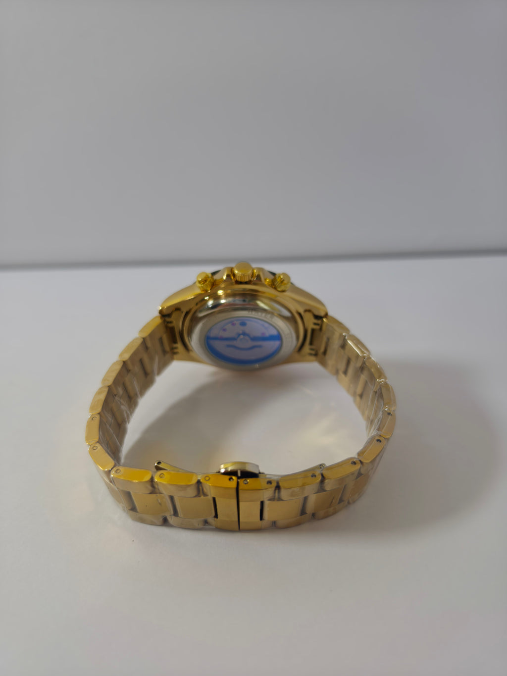 Veadons 1985 watch case back with exhibition window showing gold-tone bracelet and clasp


