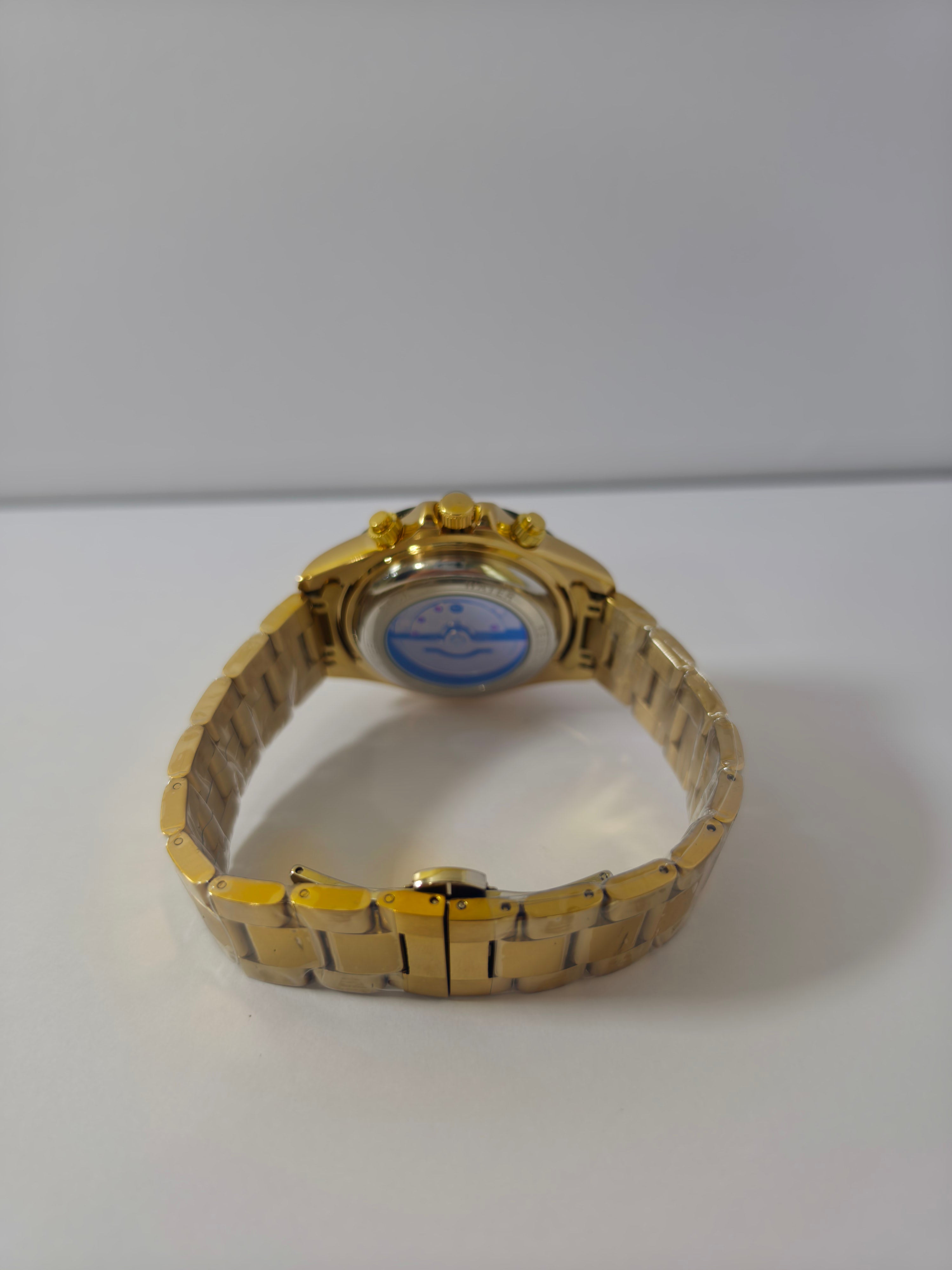 Veadons 1985 watch case back with exhibition window showing gold-tone bracelet and clasp


