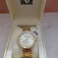 Anne Klein gold tone diamond accent watch with white mother of pearl n original box