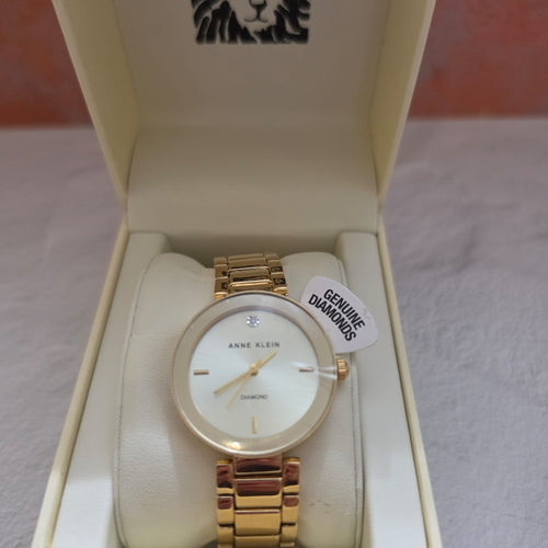 Anne Klein gold tone diamond accent watch with white mother of pearl n original box