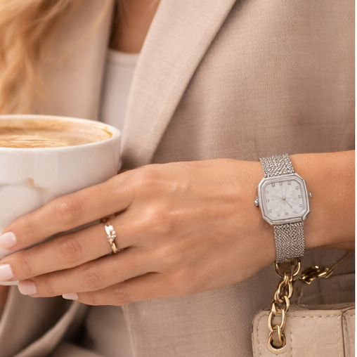 Silver-tone square case
 Elegant crystal hour markers
 Minimalist, easy-to-read dial
 Premium mesh bracelet
 Adjustable jewelry clasp for a secure fit
 Lightweight and comfortable for all-day wear
