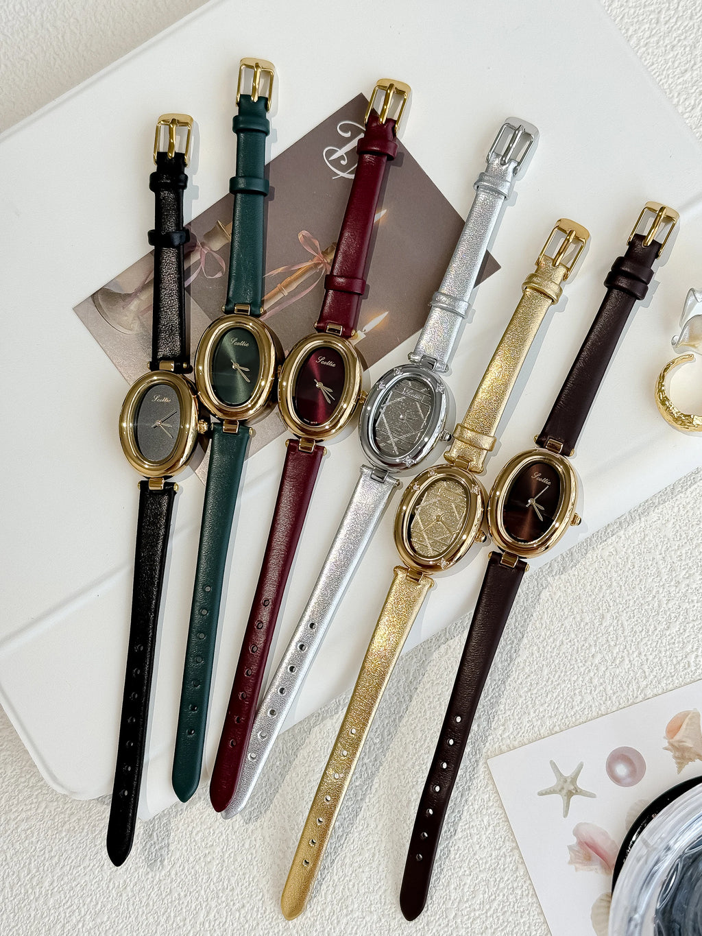 gold oval leather watch-black dial women's timepiece